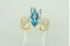 14Kt Yellow Gold Open Swirl Design Marquise Cut Blue Topaz and Diamond Ring